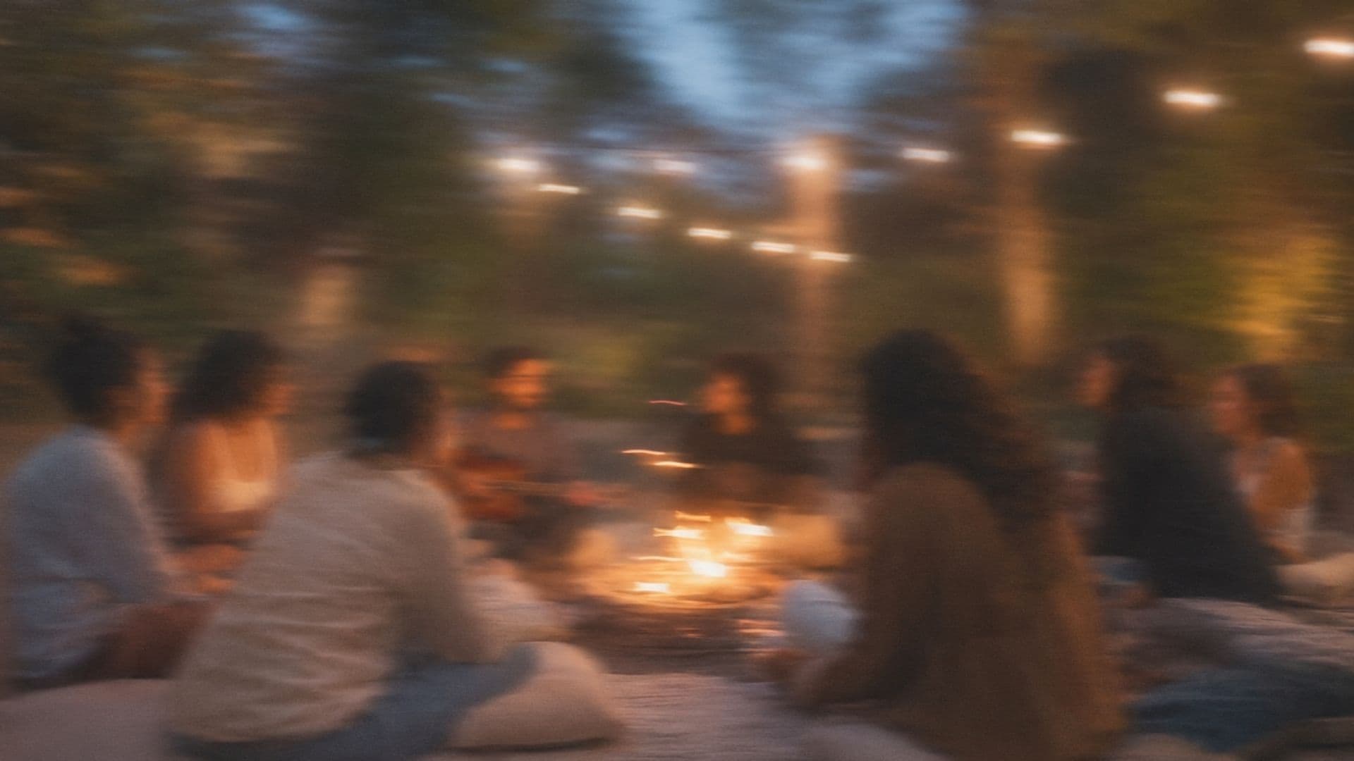 A community gathered together in a warm, blurred moment